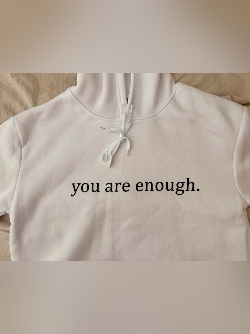 White Women's Pullover Hoodie with "you are enough” Print